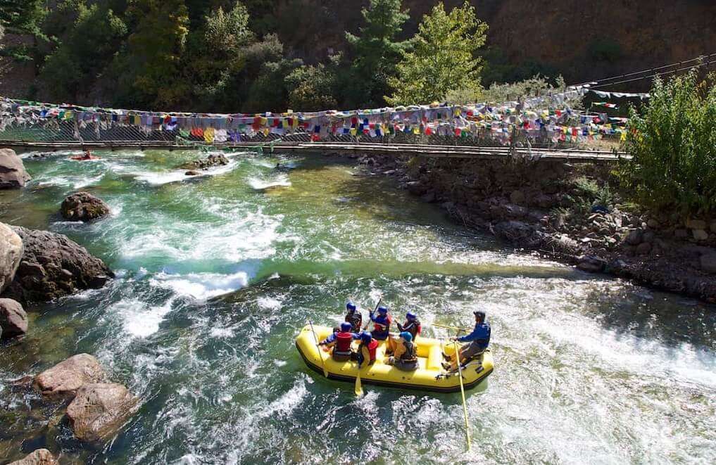 Rafting below the iron bridge at Tachog Lhakhang